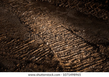 Tyre track on dirt sand or mud, Picture in retro or grunge tone. Car drive on sand. off road track.
