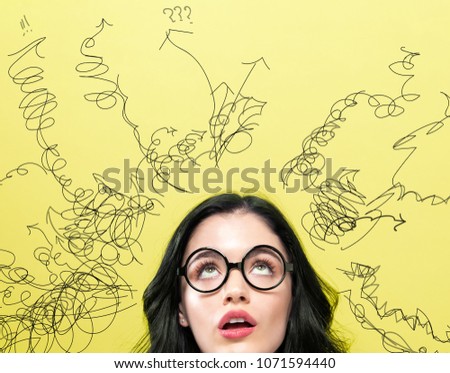 Many Thoughts with young woman on a yellow background