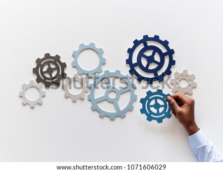 Hand with support gears isolated on white background Royalty-Free Stock Photo #1071606029