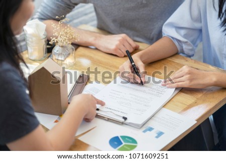woman putting signature on document contract, real estate purchase, success business contract deals with sale represent.