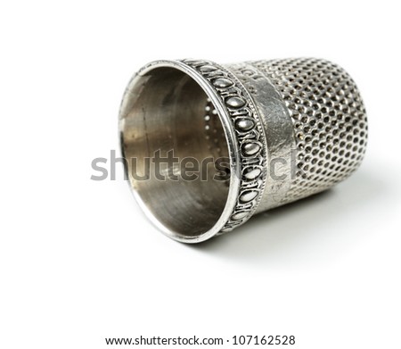 vintage silver thimble on white Royalty-Free Stock Photo #107162528