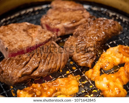 Beef steak on the grill with flames