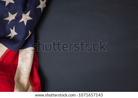 vintage American flag bordering a blank chalkboard with space for text Royalty-Free Stock Photo #1071657143