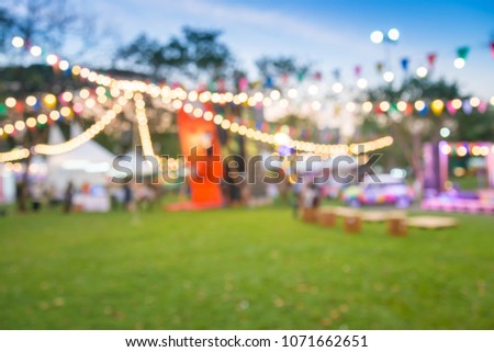 Abstract blur people in night festival city park bokeh background Royalty-Free Stock Photo #1071662651