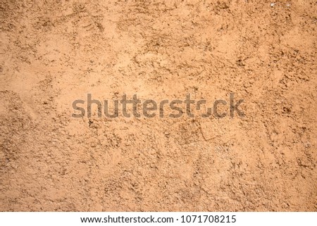 Close up clay wall for background or wallpaper, texture for decoration wall by vintage and retro style. Royalty-Free Stock Photo #1071708215