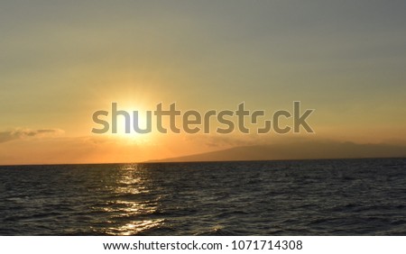 Sunset Over the Pacific Ocean Partly Cloudy