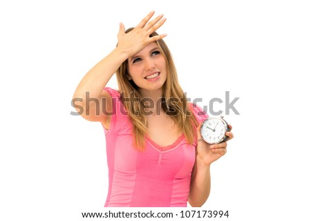 Too late,young beautiful woman holding a clock on a white background