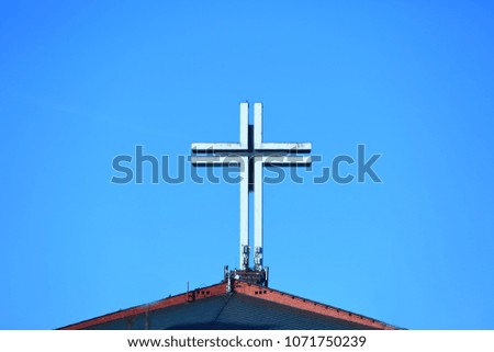 Usually on the top of the church there is a big cross as a symbol of the Christian temple.
