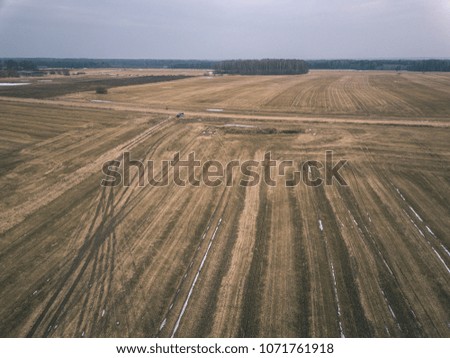 drone image. aerial view of rural area with fields in early spring. latvian agriculture landscape