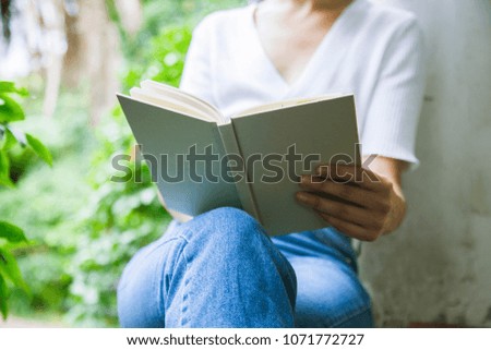 close up of a woman reading a book