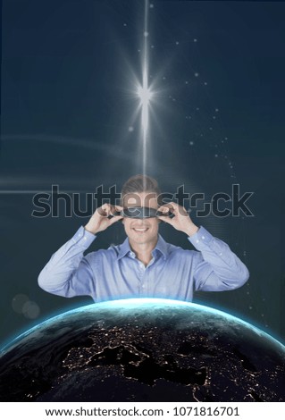 Happy man in VR headset looking to 3D planet against blue background with stars and flares