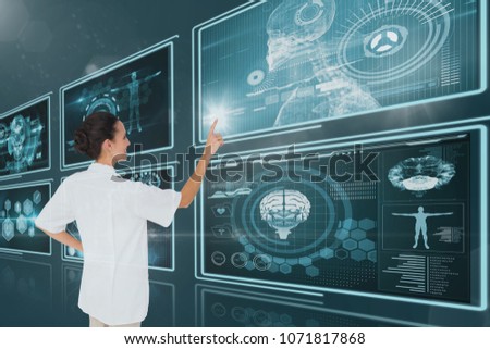 Woman doctor interacting with medical interfaces