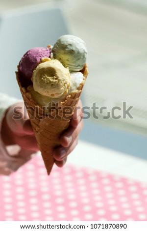 close-up of a young man holding an ice cream
