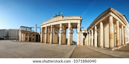 Panoramic image of Brandenburg Gate in Berlin, Germany, on a bright day with blue sky