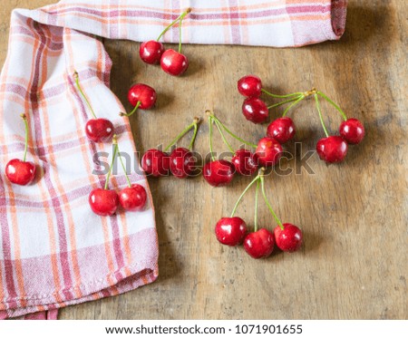 Bunch of beautiful red cherries on wooden table