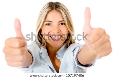 Happy woman with thumbs up and smiling - isolated over a white background