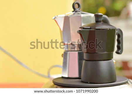 Make espresso with moka pot on electric stove with copy space. Fresh coffee in morning.  