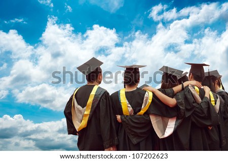 back of chinese graduates with blue sky