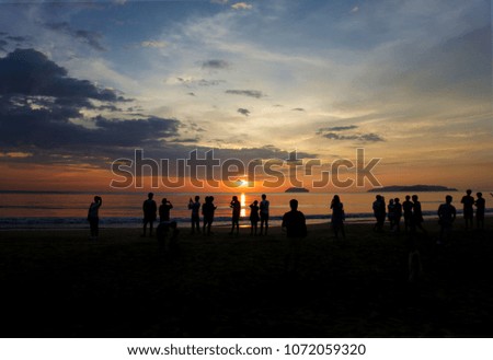 silhouette people enjoying watching sunset