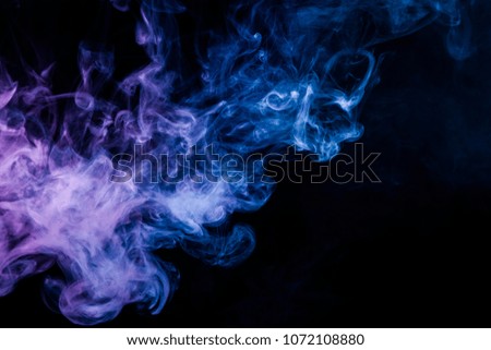 Blue cloud of smoke of  black isolated background. Background from the smoke of vape