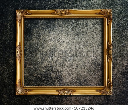 Old picture frame on grunge wall. Royalty-Free Stock Photo #107213246