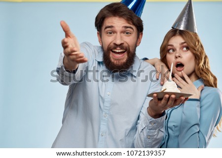 young couple on a blue background, birthday                               