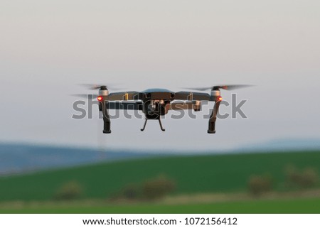 Drone quad copters with high resolution digital camera flying aerial