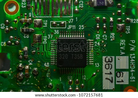 Close up picture of desk top computer motherboard components featuring detail on microchip board