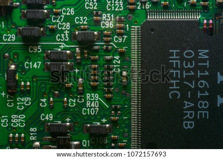 Close up picture of desk top computer motherboard components featuring detail on microchip board