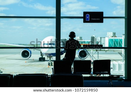 young man passenger waiting for his plane