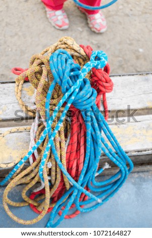 climbing equipment ropes carbines backpacks suspension for sitting climber and special shoes for rock climbing and people in training