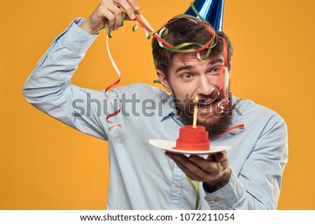 man in multi-colored ribbons               