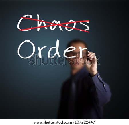 business man eliminate chaos and make order