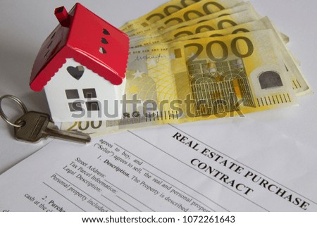 real estate and mortgage investment.house,contract,key and money on the white background.