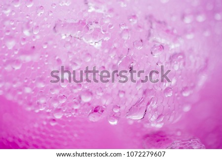 Water drops on a pink background. Blurred texture. Tenderness