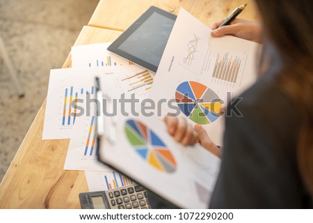 co-worker business woman are helping together to solve a problem in their work. Aerial view. no people. Royalty-Free Stock Photo #1072290200