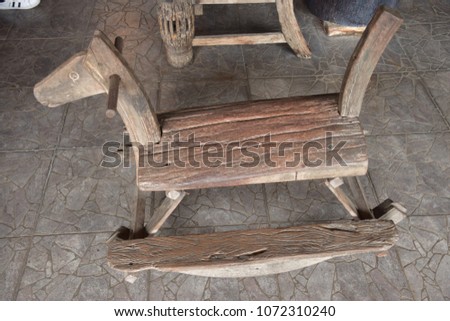 old wooden rocking horse on floor