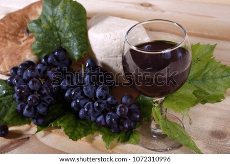 Grape, wine, cheese and bread