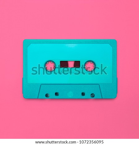 Cassette tape close up, blank for customisation of label, isolated and presented in punchy pastel colors, for nostalgic 90s creative design cover, poster, book, flyer, magazine, card, web & print Royalty-Free Stock Photo #1072356095