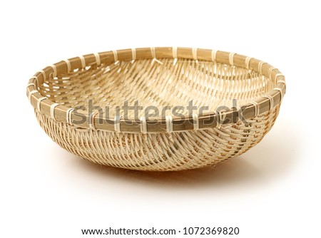 Bamboo basket hand made isolated on white background. Woven from bamboo tray. Royalty-Free Stock Photo #1072369820
