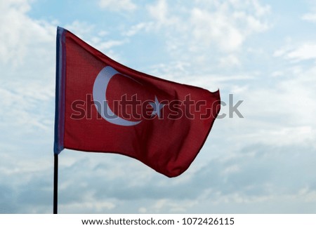 Turkish flag waving on sky