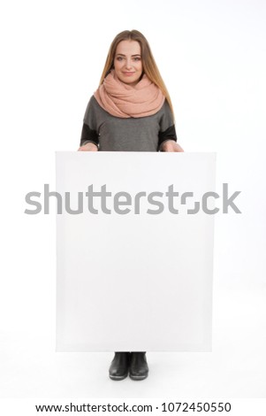 blonde girl on a white background with an empty billboard