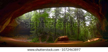 Beautiful panorama of Ash cave with rocks, sand and forest at Hocking Hills Park, USA, Ohio.