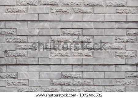 Old stone wall texture. Rough grey stone wall background.