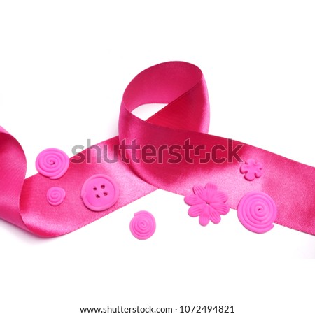 Fashionable satin pink ribbon. Pink button. 