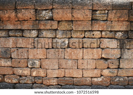 The old wall of the ancient temple is made of strong brick at Wat Mahathat Rajchaburee temple in thailand..