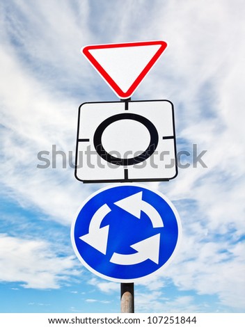 Give way sign with traffic circle