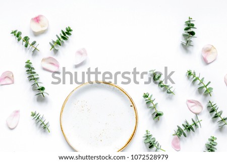 woman table with flower and herbs top view white background mock