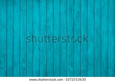 Natural Rustic Wood Board Wall Faded Blue Color Background. Wooden Vintage Style Texture. Wood Surface Fence Panel with Peeling Paint Close up. Wide Horizontal Image Copy Space. Royalty-Free Stock Photo #1072553630