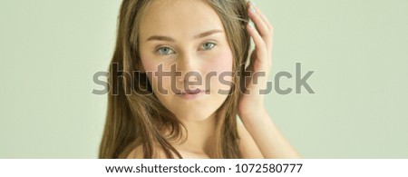 Beauty Woman face Portrait. Beautiful Spa model Girl with Perfect Fresh Clean Skin. Female looking at camera and smiling. Youth and Skin Care Concept